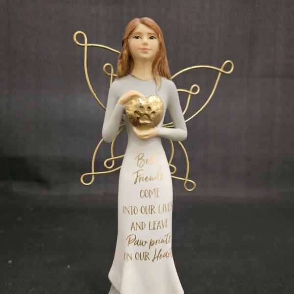 Decorative angel figurine holding a gold heart with winged wire accents