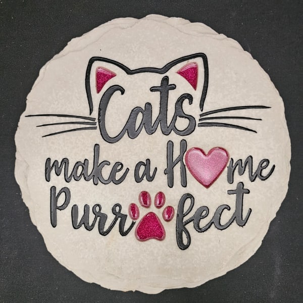 Round cat-themed sign with the words Cats make a Home Purrfect