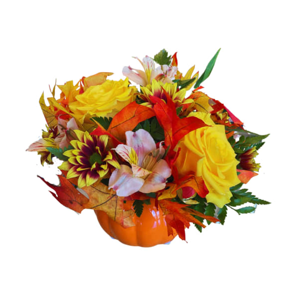 Autumn bouquet in a pumpkin vase with yellow roses and mixed flowers
