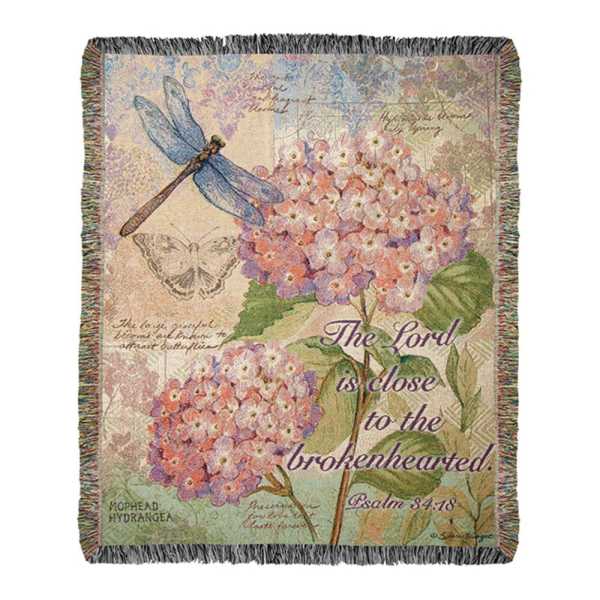 Decorative throw blanket with hydrangeas, dragonflies, and a Bible verse