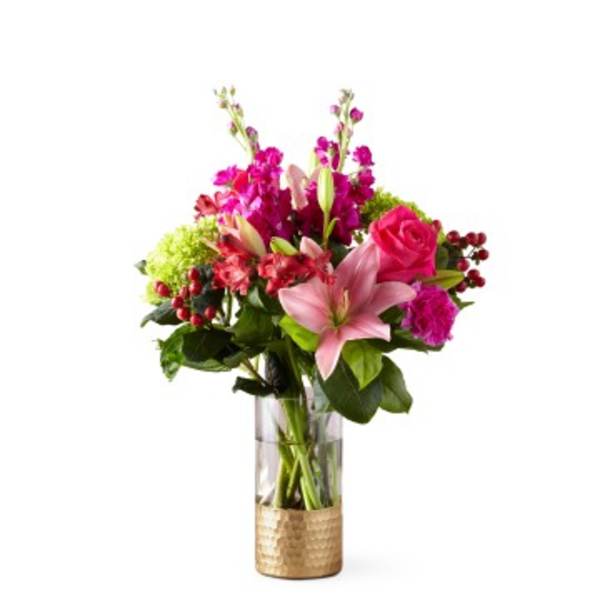 Pink and magenta mixed bouquet in a clear glass vase