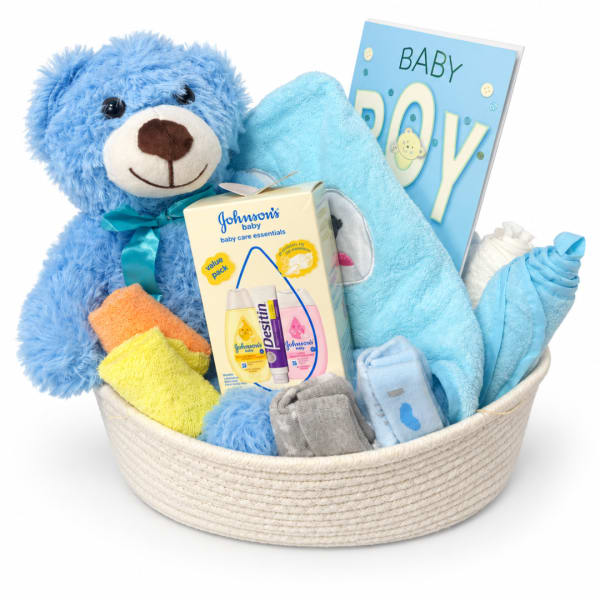 Baby gift basket with a teddy bear, blanket, card, and care items
