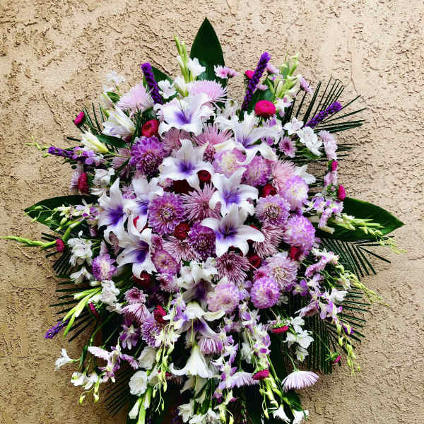 Large standing floral spray with white and purple flowers
