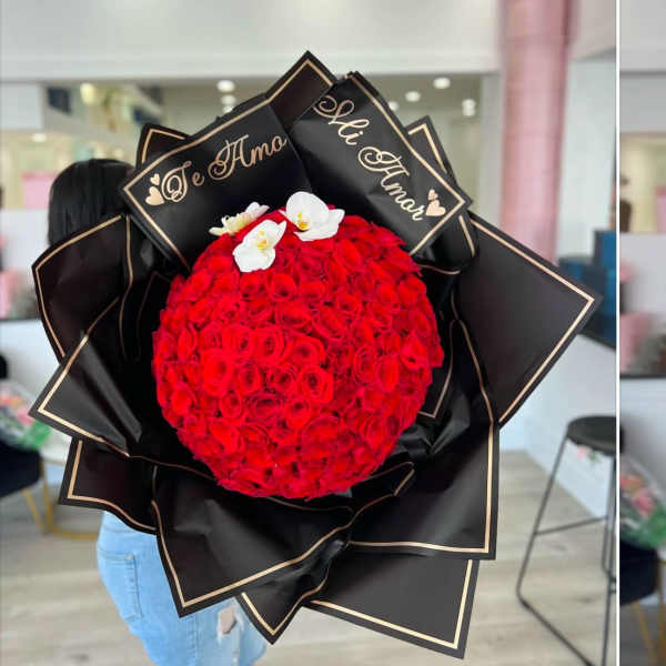 Large bouquet of red roses with white orchids in black wrap