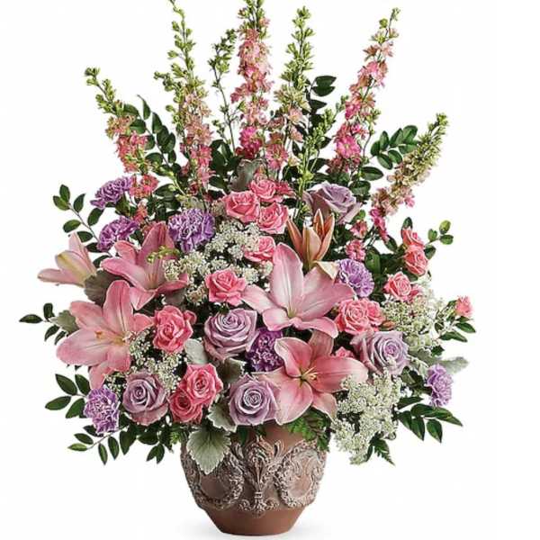 Pink and lavender floral arrangement in a decorative vase