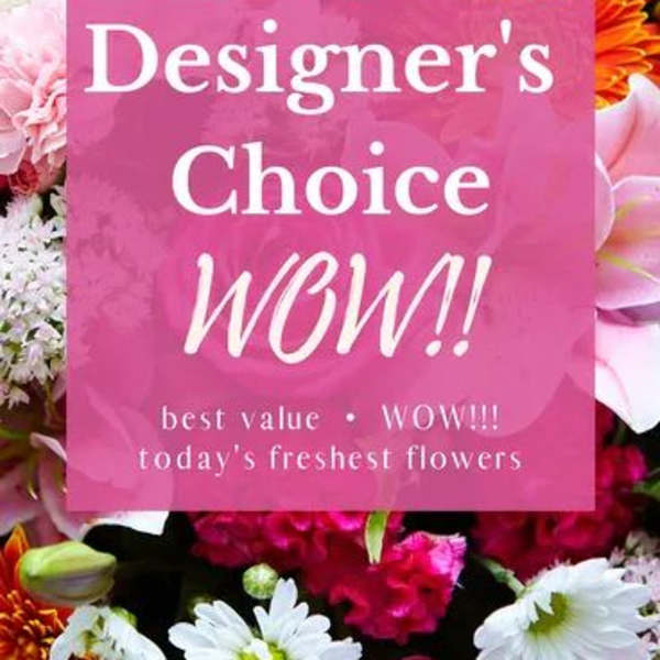 Pink sign over a colorful bouquet of mixed flowers