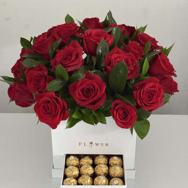 Red rose arrangement in a white box with a drawer of gold chocolates