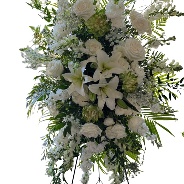 Large white floral standing spray on an easel