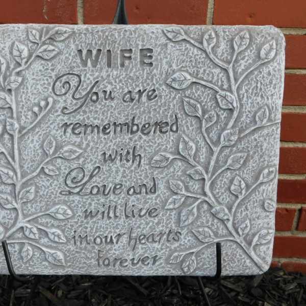 Decorative stone plaque with the words "WIFE You are remembered with Love and will live in our hearts forever"