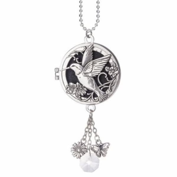 Silver hummingbird locket necklace with dangling flower, butterfly, and crystal charms