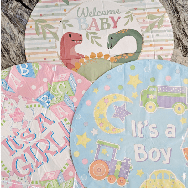 Baby shower balloons with dinosaur, ABC, and "It's a Boy" designs