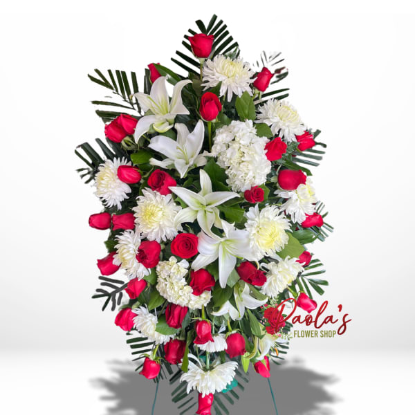 Standing spray of red roses, white lilies, and white chrysanthemums