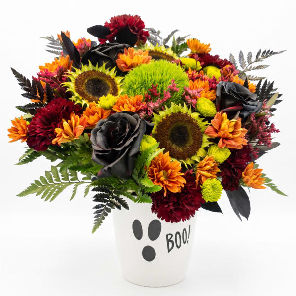 Halloween bouquet in a white vase with "BOO!" text