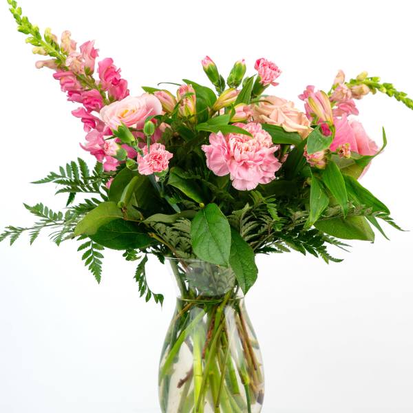 Pink mixed bouquet in a clear glass vase