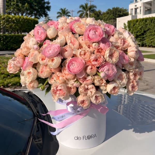 Large pink and blush bouquet in a white hat box with ribbon