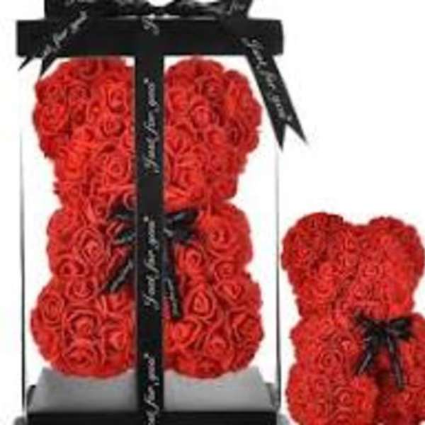 Red rose teddy bear in a black gift box with ribbon