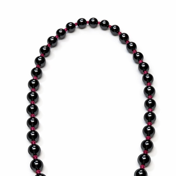 Black beaded necklace with a gold clasp on a white background