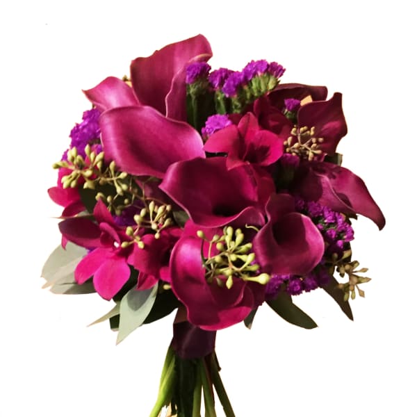Bouquet of deep magenta calla lilies and purple filler flowers