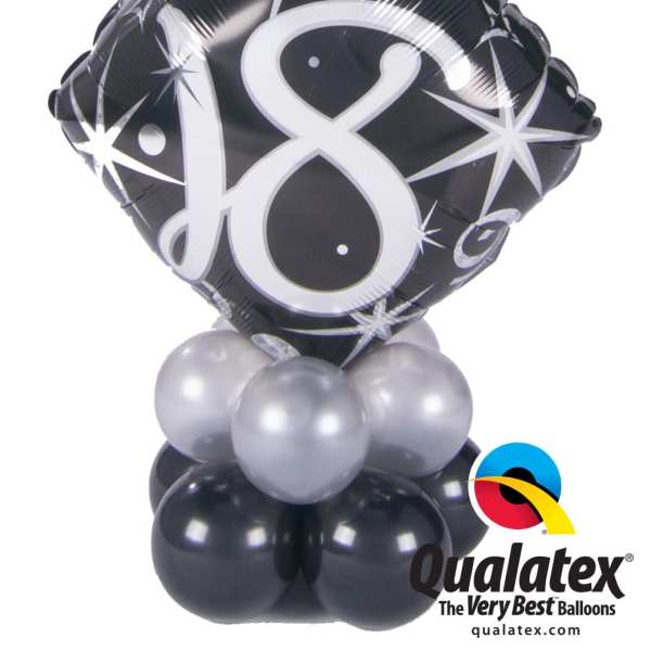 Black number 18 balloon with silver balloons at the base