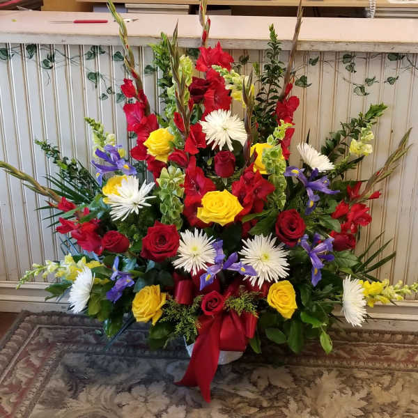 Tall mixed bouquet with red, yellow, white, and purple flowers