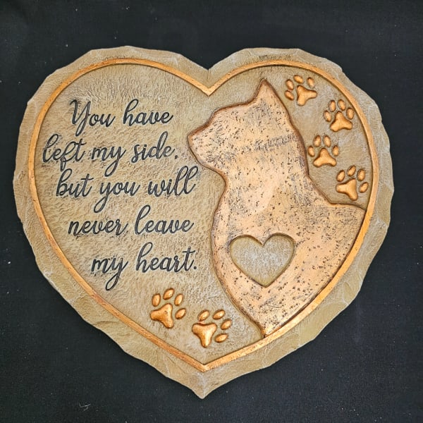 Heart-shaped memorial plaque with a cat silhouette and paw prints
