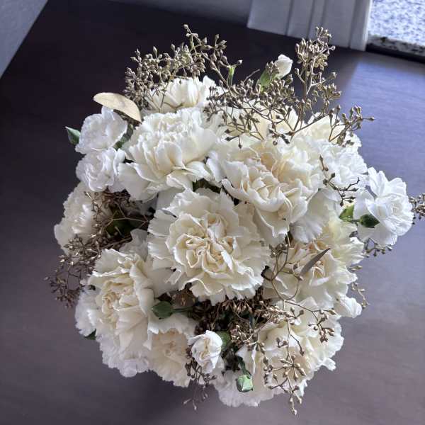 White carnation bouquet with delicate bronze filler
