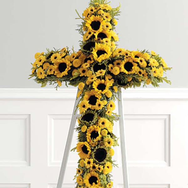 Yellow sunflower cross on a metal stand
