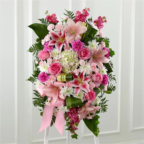 Pink and white floral standing spray with lilies and roses