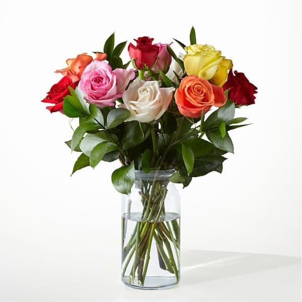 Mixed roses in a clear glass vase
