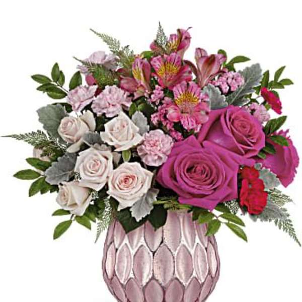 Pink and white rose bouquet in a pink textured vase