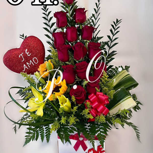 Tall bouquet of red roses and yellow lilies with a heart decoration in a white box
