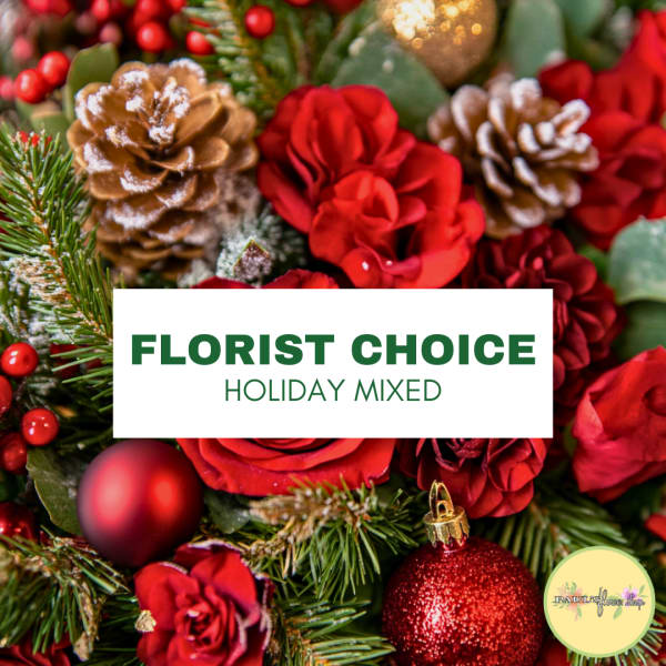 Holiday mixed arrangement with red roses and pinecones