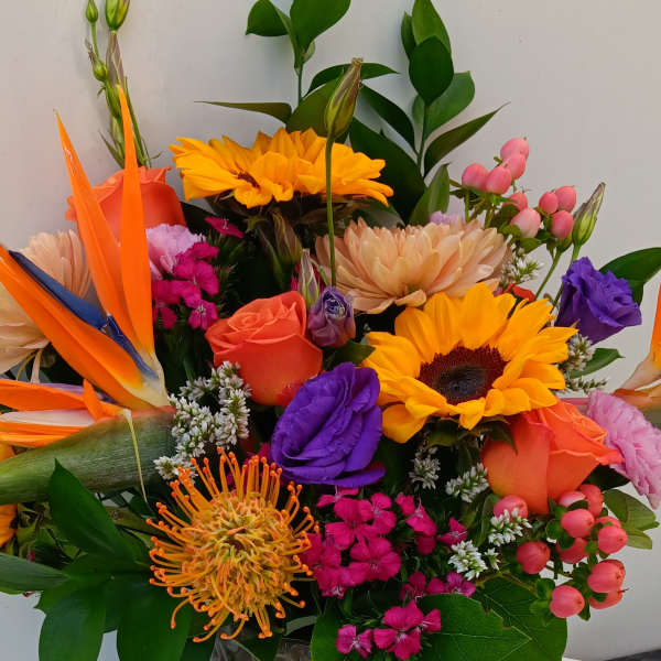 Colorful mixed bouquet in a gray textured vase