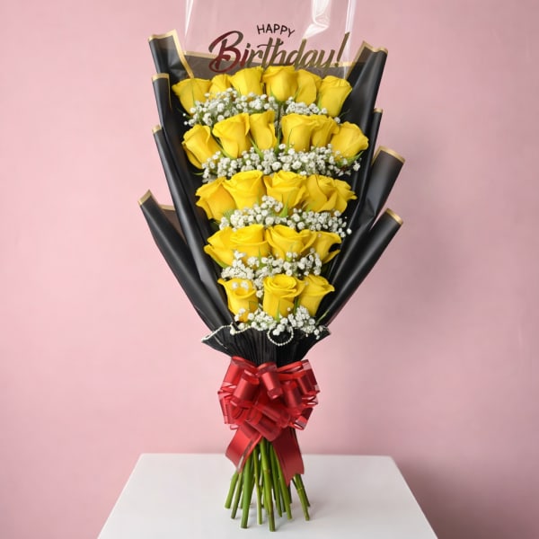 Bouquet of yellow roses with a birthday topper and red ribbon