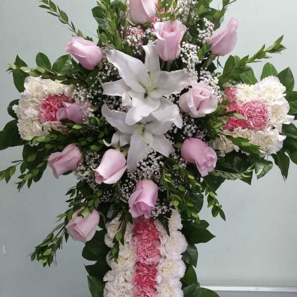 Standing floral spray with pink roses, white lilies, and carnations