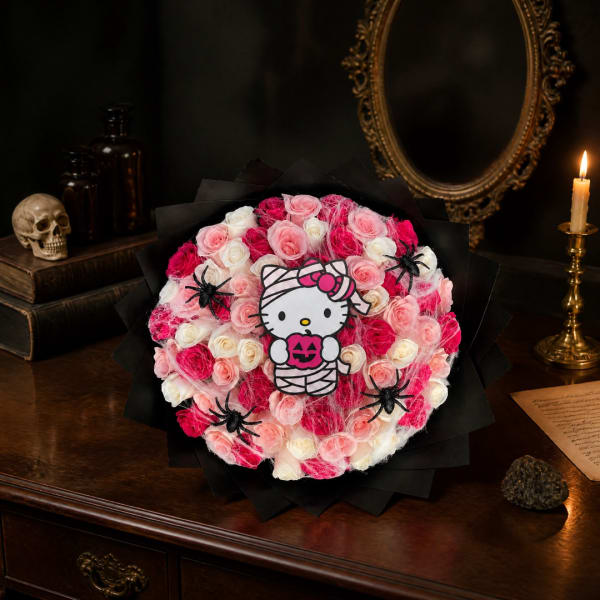 Pink and white rose bouquet with a Hello Kitty Halloween topper