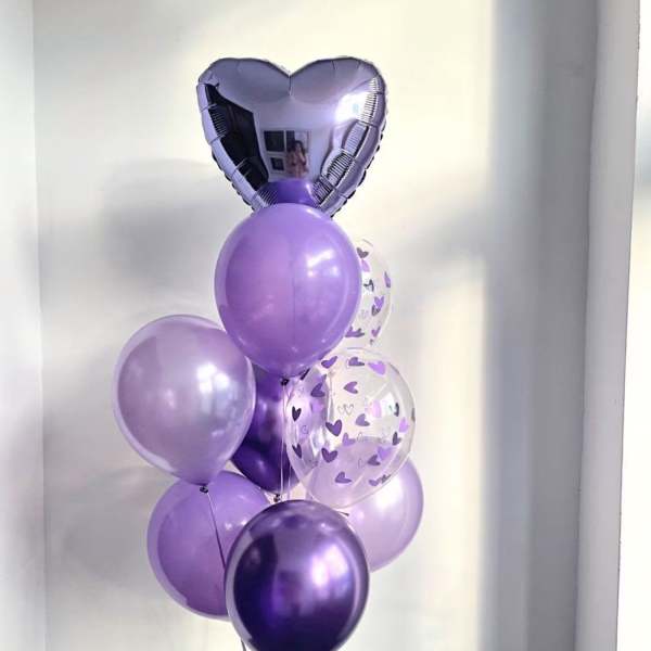 Cluster of purple balloons with a heart-shaped foil balloon on top