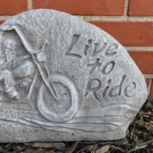 Stone sign with a motorcycle and the words "Live to Ride"