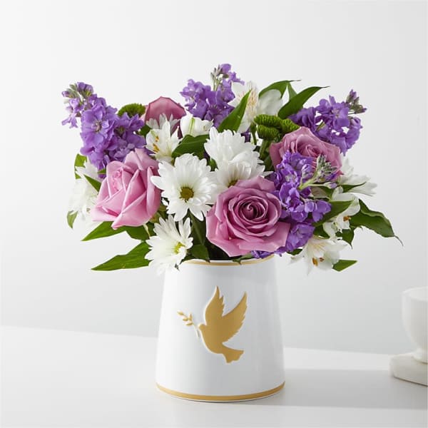 Pink and purple roses with white daisies in a white vase