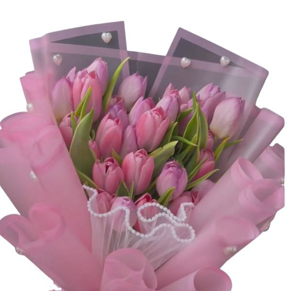 Pink tulip bouquet wrapped in translucent pink paper