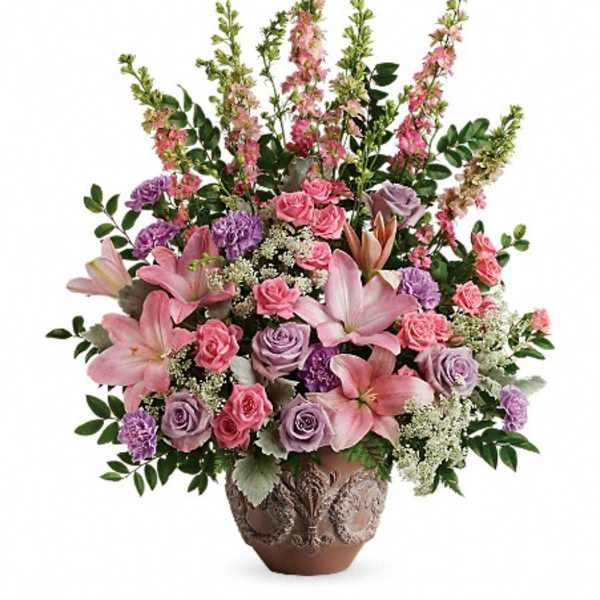 Pink and lavender floral arrangement in a decorative vase