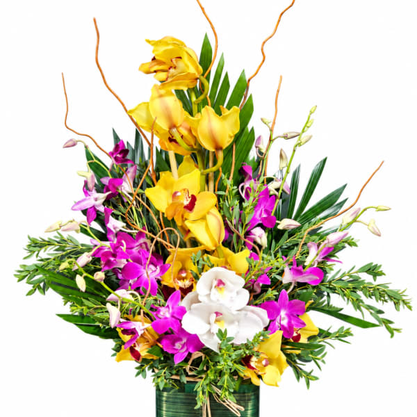 Tall arrangement of yellow and purple orchids with white blooms in a green container