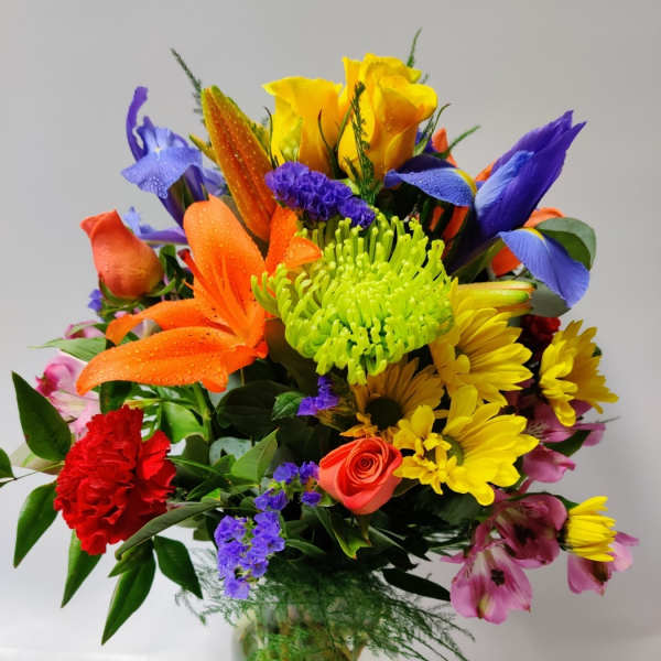 Colorful mixed bouquet in a clear glass vase