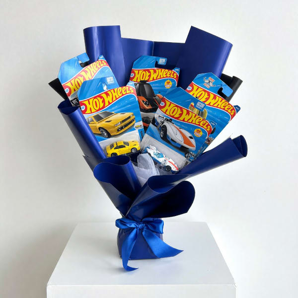 Bouquet of Hot Wheels toy cars in blue wrapping with a ribbon
