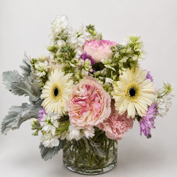 Pink and white mixed bouquet in a clear glass vase
