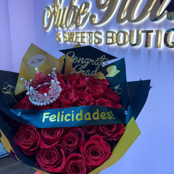 Bouquet of red roses with a small crown and graduation topper