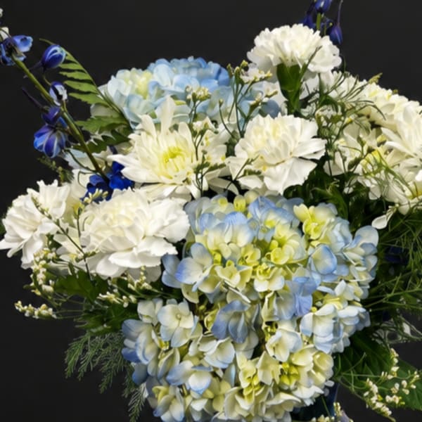 Blue and white floral arrangement with chrysanthemums and hydrangeas