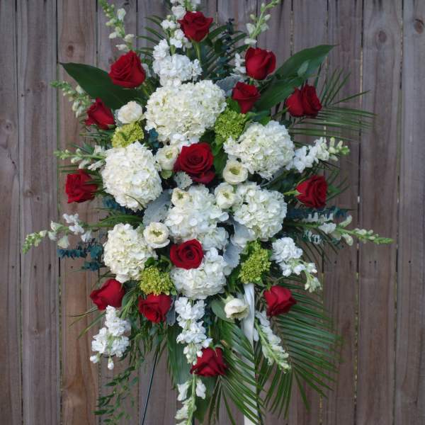 Standing floral spray with red roses and white hydrangeas