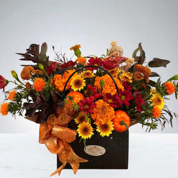 Autumn floral arrangement in a black handled box with orange ribbon