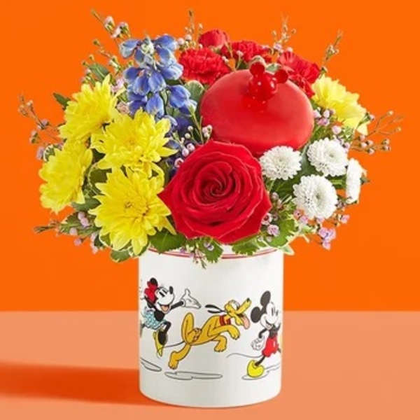 Colorful bouquet in a Mickey Mouse mug with a red balloon topper